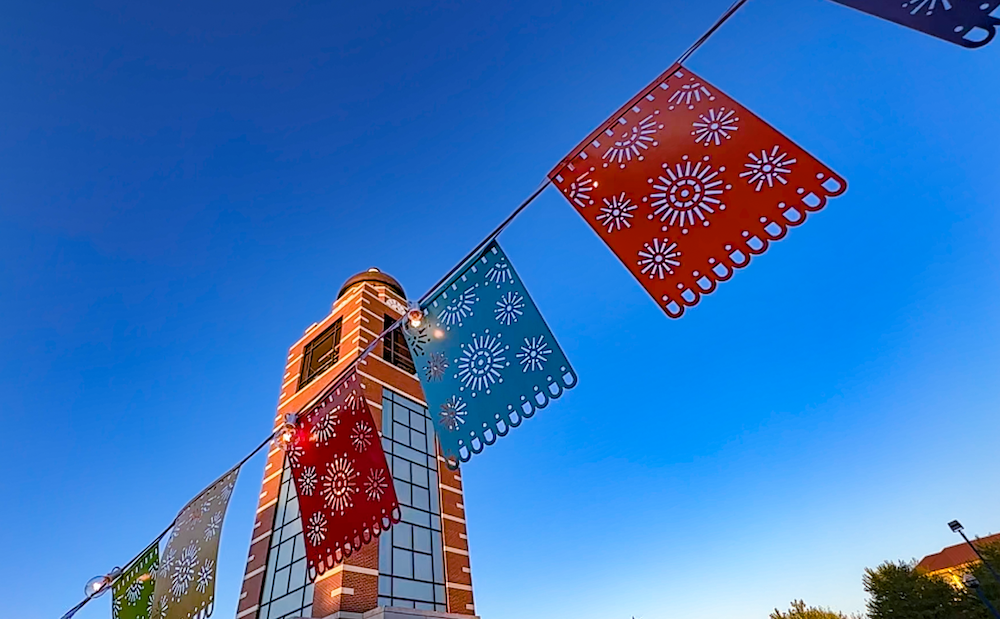 Hispanic Heritage Month, flags in the foreground, 91免费福利网 Belltower in the background